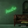 Breathe neon sign in green for meditation rooms, yoga studios, and calming home decor.