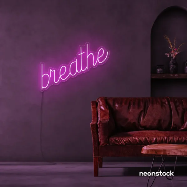 Breathe neon sign in pink for meditation rooms, yoga studios, and calming home decor.