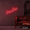 Breathe neon sign in red for meditation rooms, yoga studios, and calming home decor.