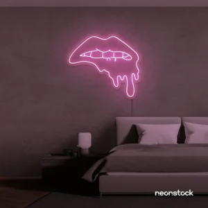 Drip lip neon sign in baby pink for glam rooms, modern wall art, and beauty salon decor.