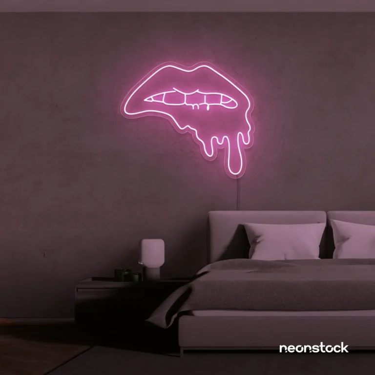Drip lip neon sign in baby pink for glam rooms, modern wall art, and beauty salon decor.