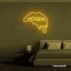 Drip lip neon sign in golden yellow for glam rooms, modern wall art, and beauty salon decor.