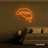 Drip lip neon sign in orange for glam rooms, modern wall art, and beauty salon decor.