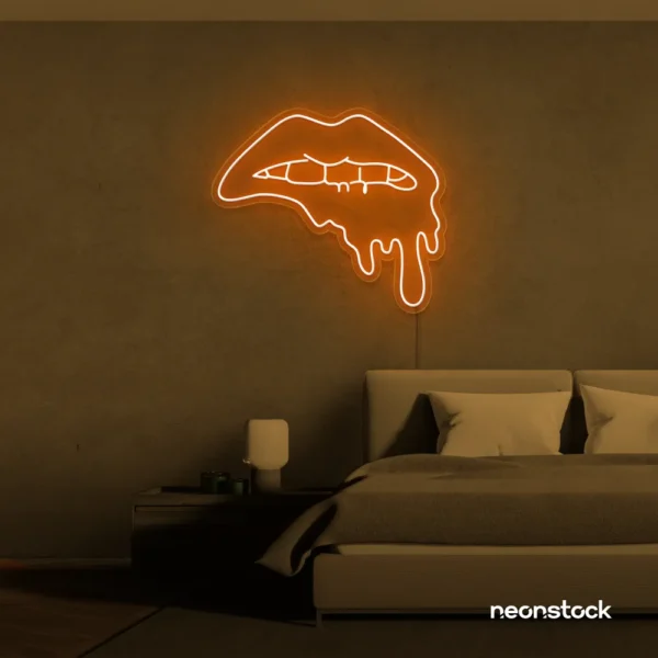 Drip lip neon sign in orange for glam rooms, modern wall art, and beauty salon decor.