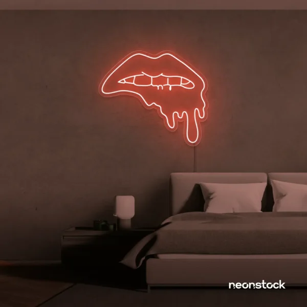 Drip lip neon sign in peachy pink for glam rooms, modern wall art, and beauty salon decor.