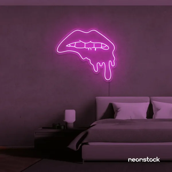 Drip lip neon sign in pink for glam rooms, modern wall art, and beauty salon decor.