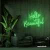 Hello Beautiful neon sign in green script font for salon styling walls and glam vanity decor.