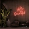 Hello Beautiful neon sign in peachy pink script font for salon styling walls and glam vanity decor.
