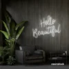 Hello Beautiful neon sign in white script font for salon styling walls and glam vanity decor.