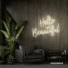 Hello Beautiful neon sign in neutral white script font for salon styling walls and glam vanity decor.
