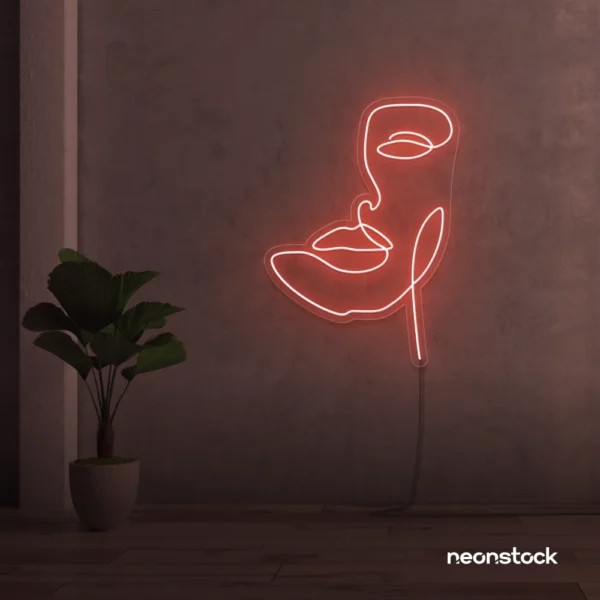 Abstract face neon sign in peachy pink for beauty salons, nail studios, and spa wall decor.