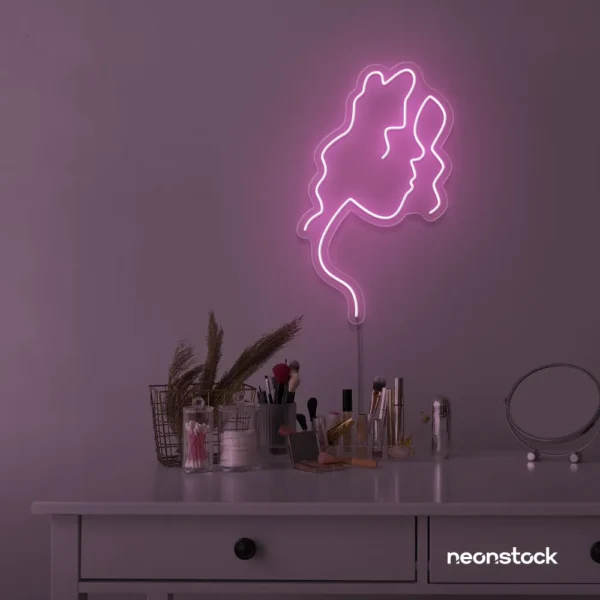 Abstract woman silhouette neon sign in baby pink for salons, studios, and feminine wall decor.