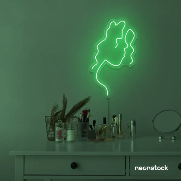 Abstract woman silhouette neon sign in green for salons, studios, and feminine wall decor.