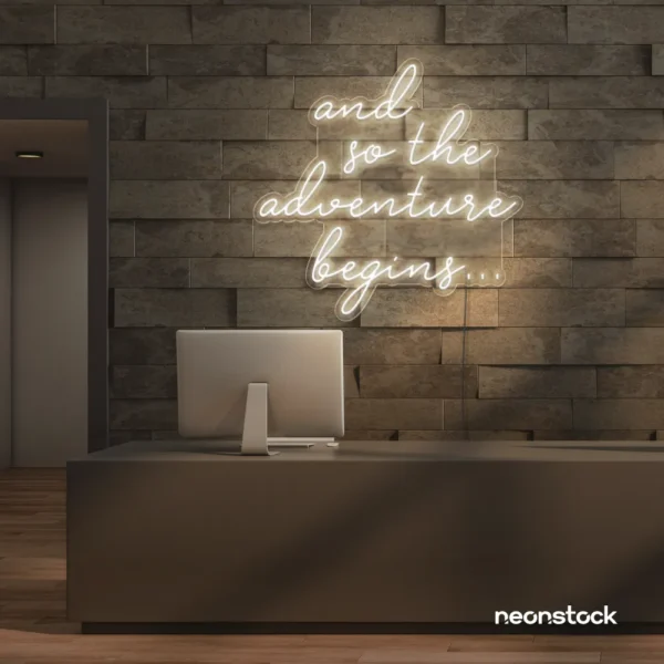 And So The Adventure Begins neon sign in neutral white for wedding decor, new beginnings, and celebration walls.
