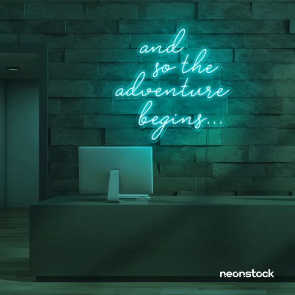 And So The Adventure Begins neon sign in mint green for wedding decor, new beginnings, and celebration walls.