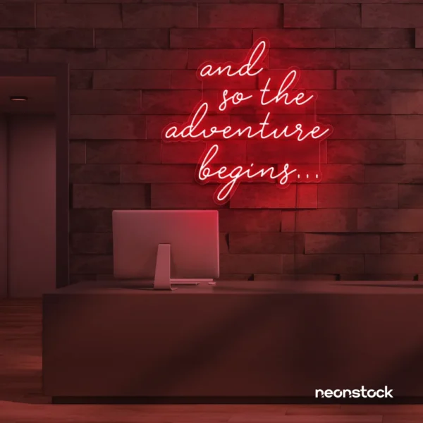 And So The Adventure Begins neon sign in red for wedding decor, new beginnings, and celebration walls.