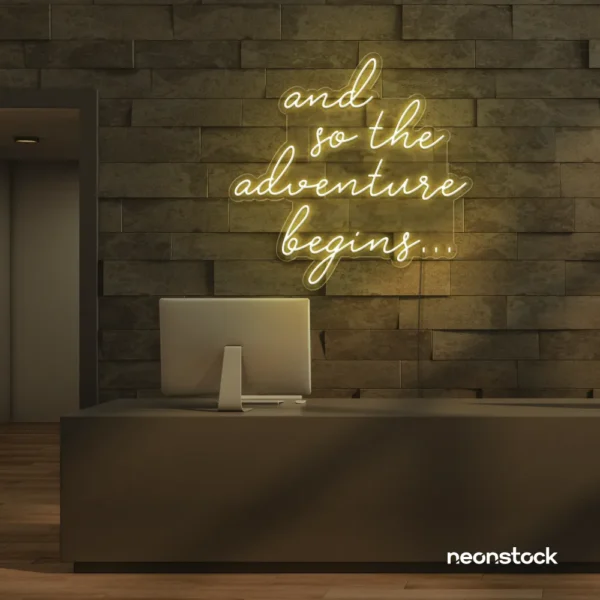 And So The Adventure Begins neon sign in warm white for wedding decor, new beginnings, and celebration walls.