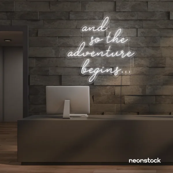 And So The Adventure Begins neon sign in white for wedding decor, new beginnings, and celebration walls.