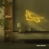 Dachshund dog neon sign in golden yellow for pet decor and dog-themed wall art.