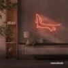 Dachshund dog neon sign in peachy pink for pet decor and dog-themed wall art.