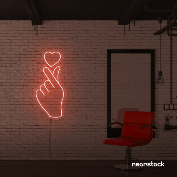 Finger heart neon sign in peachy pink for bedroom and dorm room decor
