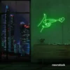 Hands shooting heart neon sign in deep green – romantic LED wall decor.