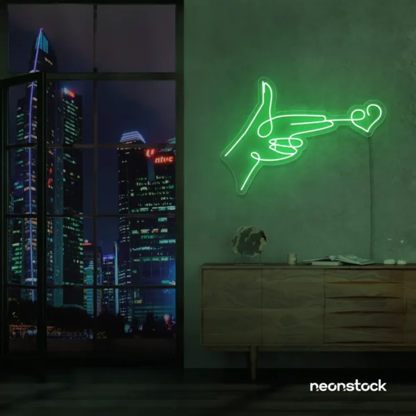 Hands shooting heart neon sign in green – romantic LED wall decor.