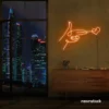 Hands shooting heart neon sign in orange – romantic LED wall decor.