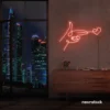 Hands shooting heart neon sign in peachy pink – romantic LED wall decor.