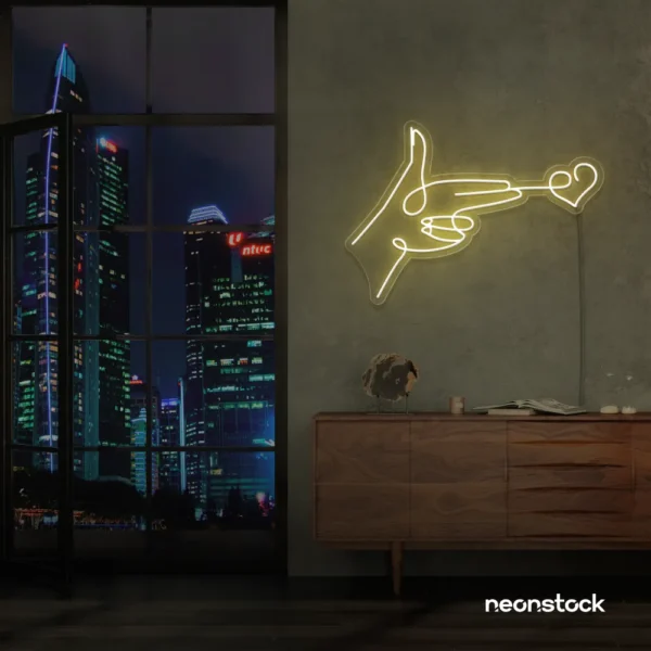 Hands shooting heart neon sign in warm white – romantic LED wall decor.