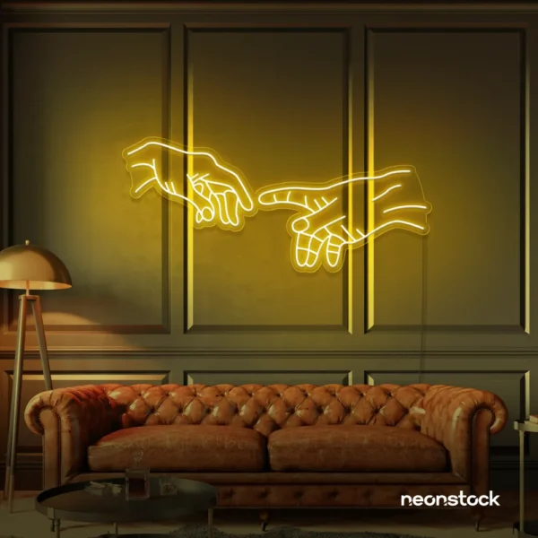 Hands neon sign in golden yellow – modern wall art symbolizing connection and emotion.