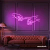Hands neon sign in pink – modern wall art symbolizing connection and emotion.