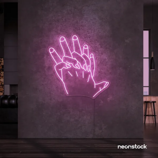 Holding hands neon sign in baby pink – emotional LED wall decor.