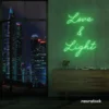Love and Light neon sign in green for weddings, romantic decor, and celebration backdrops.