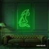 Sitting woman neon sign in deep green for minimalist wall art and feminine home decor.