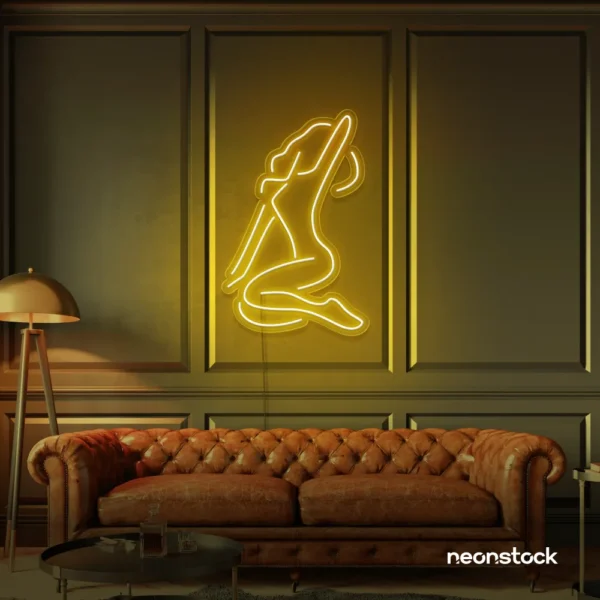 Sitting woman neon sign in golden yellow for minimalist wall art and feminine home decor.
