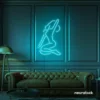 Sitting woman neon sign in mint green for minimalist wall art and feminine home decor.