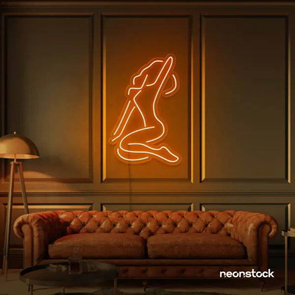 Sitting woman neon sign in orange for minimalist wall art and feminine home decor.