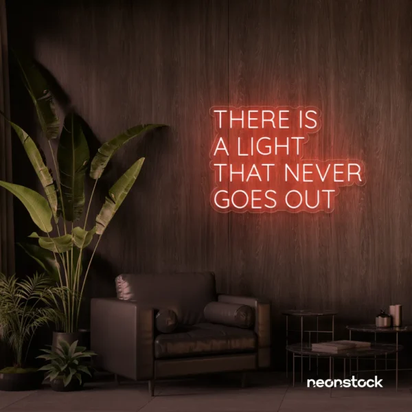There's a Light That Never Goes Out neon sign in peachy pink for aesthetic rooms and ambient wall decor.