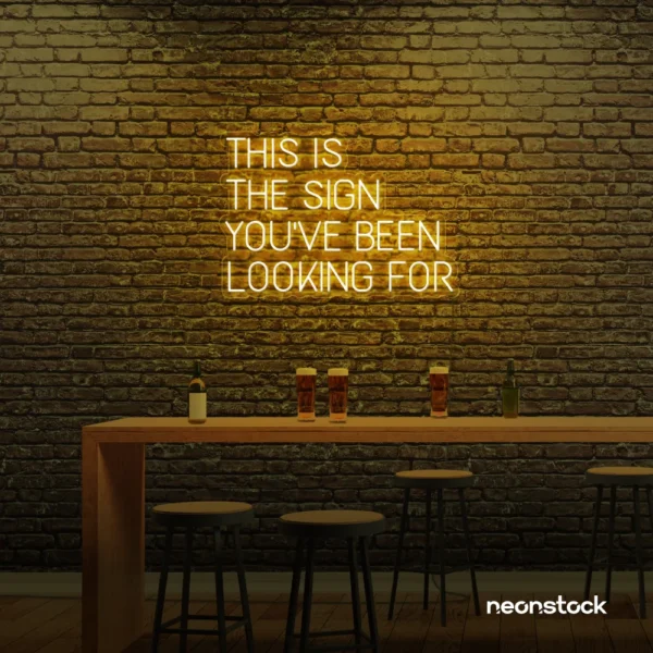 This Is The Sign You’ve Been Looking For neon sign in golden yellow for modern wall decor and motivational rooms.