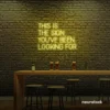 This Is The Sign You’ve Been Looking For neon sign in lemon yellow for modern wall decor and motivational rooms.