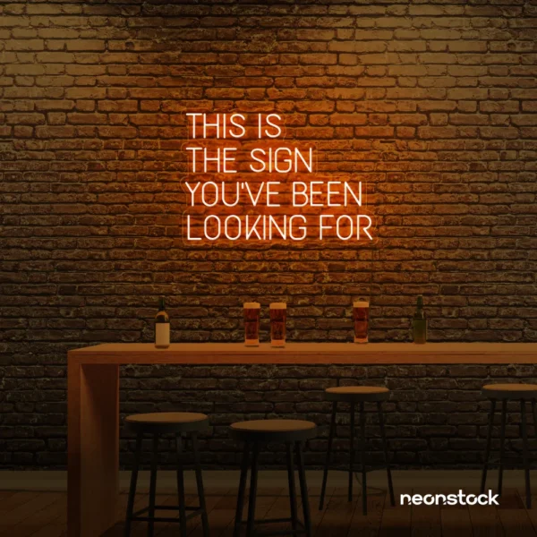 This Is The Sign You’ve Been Looking For neon sign in orange for modern wall decor and motivational rooms.