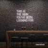 This Is The Sign You’ve Been Looking For neon sign in white for modern wall decor and motivational rooms.