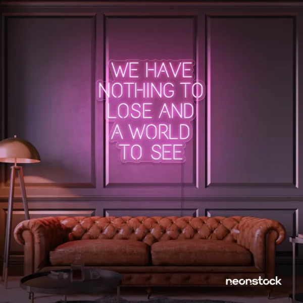 We Have Nothing to Lose and a World to See neon sign in baby pink for travel wall art and decor lovers.