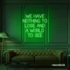 We Have Nothing to Lose and a World to See neon sign in deep green for travel wall art and decor lovers.