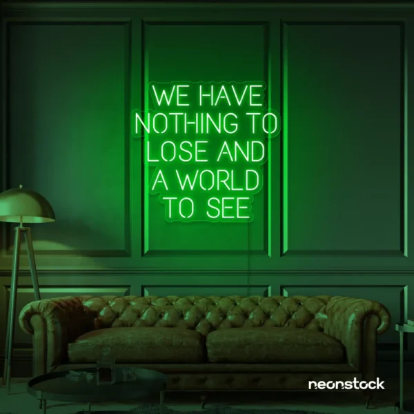 We Have Nothing to Lose and a World to See neon sign in deep green for travel wall art and decor lovers.