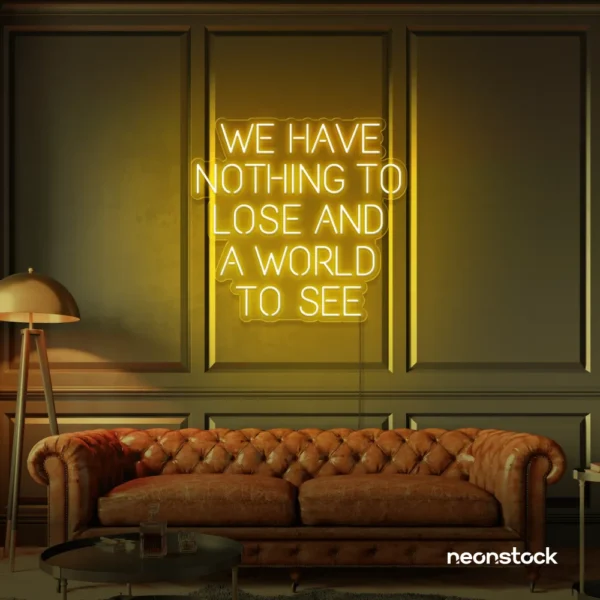 We Have Nothing to Lose and a World to See neon sign in golden yellow for travel wall art and decor lovers.