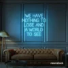 We Have Nothing to Lose and a World to See neon sign in ice blue for travel wall art and decor lovers.