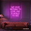 We Have Nothing to Lose and a World to See neon sign in pink for travel wall art and decor lovers.
