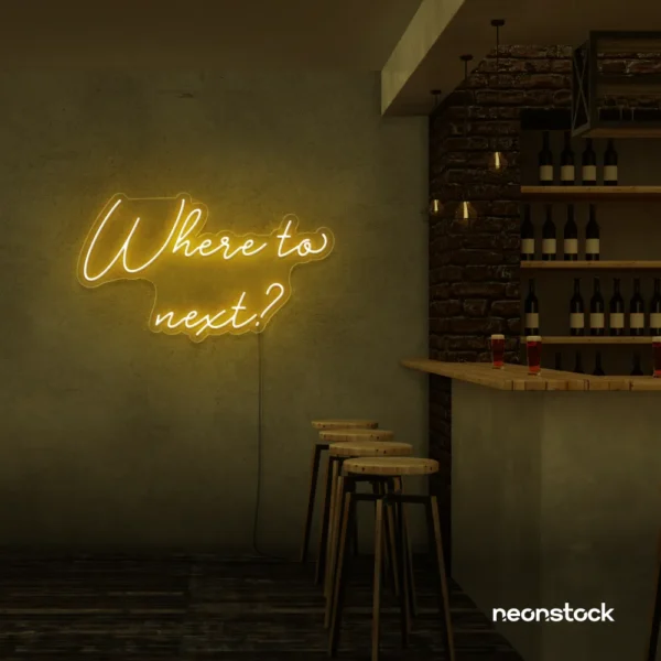 Where To Next neon sign in golden yellow